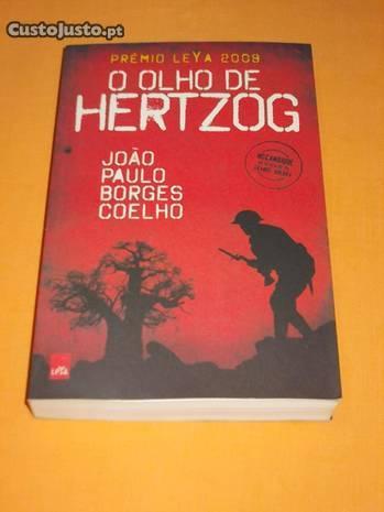 (f) O Olho de Hertzog (Oferta de Portes)